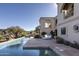 Luxury pool and spa with spacious patio and stunning desert landscape at 10420 E Morning Vista Ln, Scottsdale, AZ 85262