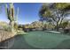 Expansive putting green with scenic views at 10420 E Morning Vista Ln, Scottsdale, AZ 85262