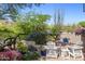 Private putting green surrounded by beautiful desert landscaping at 10420 E Morning Vista Ln, Scottsdale, AZ 85262