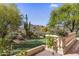 Backyard putting green with desert landscaping and mountain views at 10420 E Morning Vista Ln, Scottsdale, AZ 85262