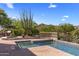 Sparkling swimming pool and hot tub with lush landscaping at 10420 E Morning Vista Ln, Scottsdale, AZ 85262
