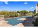 Swimming pool with lounge chairs and beautiful desert landscape at 10420 E Morning Vista Ln, Scottsdale, AZ 85262