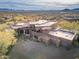 Expansive aerial view showcases estate home, desert landscape, and stunning mountain backdrop at 10922 E Purple Aster Way, Scottsdale, AZ 85262