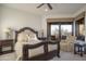 Bedroom features a plush chair, end tables and a dark wood bed frame at 10922 E Purple Aster Way, Scottsdale, AZ 85262