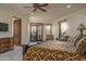 Bedroom with balcony, light colored carpet, and a decorative bed frame at 10922 E Purple Aster Way, Scottsdale, AZ 85262