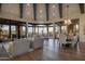 Spacious living room features beamed ceilings, curved windows with stunning outdoor views at 10922 E Purple Aster Way, Scottsdale, AZ 85262