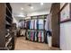 Walk-in closet with custom shelving and storage for shoes and folded garments at 10922 E Purple Aster Way, Scottsdale, AZ 85262