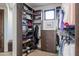 The walk-in closet has custom storage and shelving at 10922 E Purple Aster Way, Scottsdale, AZ 85262
