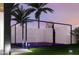 Outdoor basketball court featuring a hoop and lighting, surrounded by palm trees and a landscaped lawn at 11612 N 86Th St, Scottsdale, AZ 85260