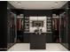 Walk-in closet with custom shelving, a central island, and ample storage space for an organized wardrobe at 11612 N 86Th St, Scottsdale, AZ 85260
