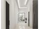 Bright hallway with polished floors leading to a window with a view of greenery at 11612 N 86Th St, Scottsdale, AZ 85260