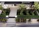 Landscaped front yard featuring palm trees, modern lighting, and walkway at 11612 N 86Th St, Scottsdale, AZ 85260
