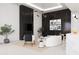 Bright living room with stylish seating, a black marble accent wall, and modern lighting at 11612 N 86Th St, Scottsdale, AZ 85260