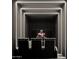 Modern movie room with tiered seating, ambient lighting, and a large screen for an immersive experience at 11612 N 86Th St, Scottsdale, AZ 85260