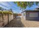 Backyard view with gravel and wood fence at 12023 N 113Th Ave, Youngtown, AZ 85363