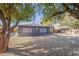 Large backyard with gravel and mature trees at 12023 N 113Th Ave, Youngtown, AZ 85363