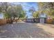 Large backyard with gravel and mature trees at 12023 N 113Th Ave, Youngtown, AZ 85363