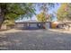 Large backyard with gravel and mature trees at 12023 N 113Th Ave, Youngtown, AZ 85363