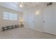 Spacious bedroom with tile floors, double closets, and a ceiling fan at 12023 N 113Th Ave, Youngtown, AZ 85363