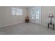 Versatile bonus room with tile floors, French doors, and a garden view at 12023 N 113Th Ave, Youngtown, AZ 85363