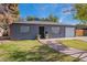 Charming gray house with a brick walkway, and a spacious lawn at 12023 N 113Th Ave, Youngtown, AZ 85363