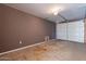 Garage with overhead door and extra space at 12023 N 113Th Ave, Youngtown, AZ 85363