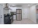 Updated kitchen with stainless steel appliances and white cabinets at 12023 N 113Th Ave, Youngtown, AZ 85363