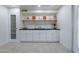 Modern kitchen with white cabinets, black countertops, and a stainless steel stove at 12023 N 113Th Ave, Youngtown, AZ 85363
