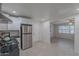 Bright kitchen boasts stainless steel appliances and white cabinets at 12023 N 113Th Ave, Youngtown, AZ 85363