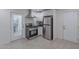 Modern kitchen featuring stainless steel appliances and white cabinetry at 12023 N 113Th Ave, Youngtown, AZ 85363