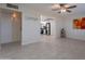Spacious living room with tile flooring and ceiling fan at 12023 N 113Th Ave, Youngtown, AZ 85363