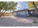 Back patio with brick pavers and gray building at 12023 N 113Th Ave, Youngtown, AZ 85363