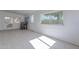 Bright sunroom features tile floors, a table with chairs, and access to the backyard at 12023 N 113Th Ave, Youngtown, AZ 85363