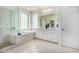 Elegant bathroom with double vanity, soaking tub, and shower at 1263 E Brookwood Ct, Phoenix, AZ 85048