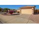 Attached garage with a driveway at 13370 W Port Au Prince Ln, Surprise, AZ 85379