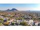 Aerial view of community with mountain and city views at 13503 E Summit Dr, Scottsdale, AZ 85259