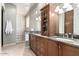 Bathroom with double vanity, granite countertop, and glass shower at 13503 E Summit Dr, Scottsdale, AZ 85259
