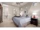 Bright bedroom with ensuite bathroom access and ceiling fan at 13503 E Summit Dr, Scottsdale, AZ 85259
