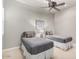 Guest bedroom with twin beds, ceiling fan, and ample natural light at 13503 E Summit Dr, Scottsdale, AZ 85259