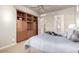 Bedroom with built-in shelving and ensuite bathroom access at 13503 E Summit Dr, Scottsdale, AZ 85259