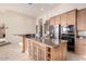 Large kitchen island with granite countertops and storage at 13503 E Summit Dr, Scottsdale, AZ 85259