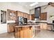 Large kitchen with a center island and a full suite of stainless steel appliances at 13503 E Summit Dr, Scottsdale, AZ 85259
