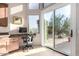Bright office space off kitchen with mountain views and patio access at 13503 E Summit Dr, Scottsdale, AZ 85259