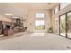 Spacious living area featuring high ceilings, an open layout, and large windows showcasing scenic outdoor views at 13503 E Summit Dr, Scottsdale, AZ 85259