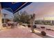 Evening view of patio with seating, fire pit, and mountain views at 13503 E Summit Dr, Scottsdale, AZ 85259