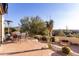 Outdoor patio with seating, fire pit, and scenic desert views at 13503 E Summit Dr, Scottsdale, AZ 85259