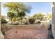 Peaceful backyard patio with lush landscaping and mountain views at 13503 E Summit Dr, Scottsdale, AZ 85259