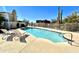 Community pool with lounge chairs and mountain views at 13503 E Summit Dr, Scottsdale, AZ 85259