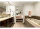 Elegant bathroom with double sinks, soaking tub, and separate shower at 140 E Rio Salado Pkwy # 111, Tempe, AZ 85281
