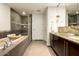 Spa-like bathroom with a large soaking tub and double vanity at 140 E Rio Salado Pkwy # 111, Tempe, AZ 85281